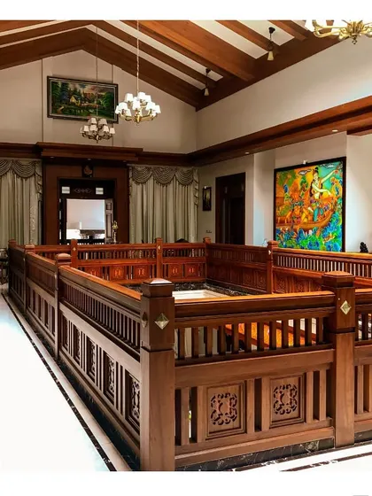 Another perspective of the traditional courtyard railing, demonstrating the precision of the woodwork and the seamless integration of art and architecture. The design balances open space with detailed craftsmanship.