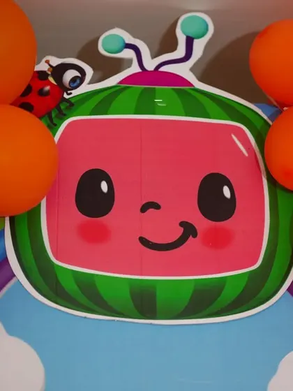 A close-up of the iconic Cocomelon logo, used as a prop in our themed decorations. It's these recognizable details that get the kids excited.