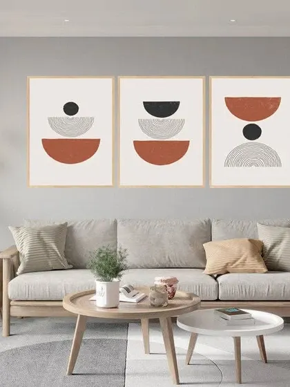 This set of three abstract art frames features a conglomerate of ringlets and semi-circles. The earthy tones and geometric patterns create a cohesive and modern triptych perfect for a large wall.