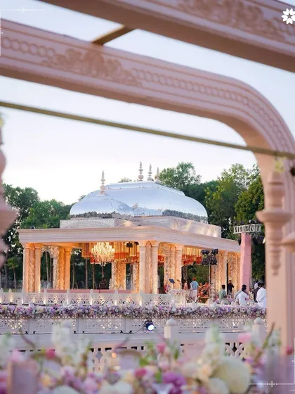 A view of the magnificent 'Saanjh Niwas' setup for the Adani wedding. Hosting events of this scale is a testament to our capability to execute grand visions, transforming open spaces into architectural marvels that honour heritage and celebration.