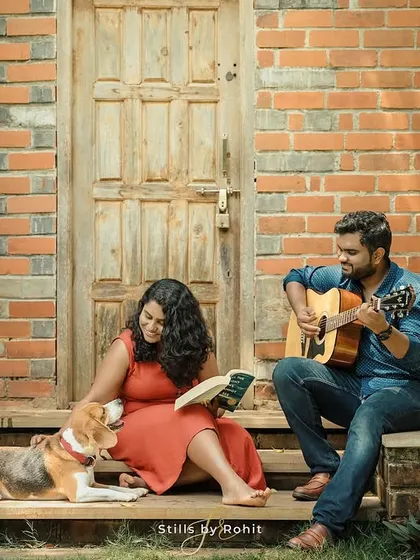 A quiet, relaxed afternoon with a couple enjoying a book and a song, with their loyal beagle resting at their feet. This is a perfect example of a lifestyle session that tells a story about your life together.