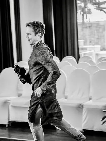 The getaway. The groom's brother makes a run for it after successfully retrieving the stolen shoes.