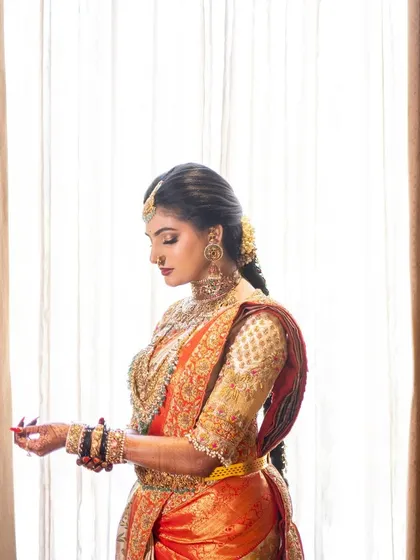 Our gorgeous bride Jhanvi, lavished in perfect grace for her big day. This portrait captures her serene beauty and the intricate details of her custom-embroidered bridal blouse.