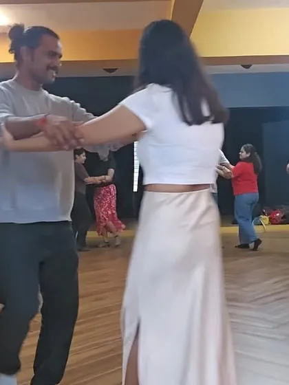 Students pair up during a free Tango introduction workshop. Notice the smiles and relaxed atmosphere. My classes are about connection and enjoyment, not pressure or perfection.
