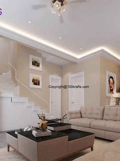 The spacious living area of the 'Ozone Villas' project, featuring a clean, neutral color palette, elegant crown molding, and a modern staircase, creating a grand and airy feel.