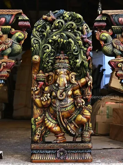 This vibrant, multicolored dancing Ganesha panel, flanked by a pair of Annapakshi wall brackets, is a testament to our detailed Jali or latticework. The 36-inch Ganapathy sculpture is a centerpiece that brings divine energy and artistic heritage to any space.
