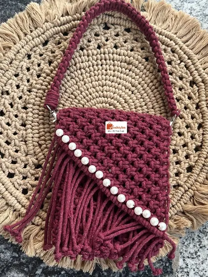 A beautiful wine-red handbag with pearl details. This piece is perfect for parties or when you want to feel a little fancy.