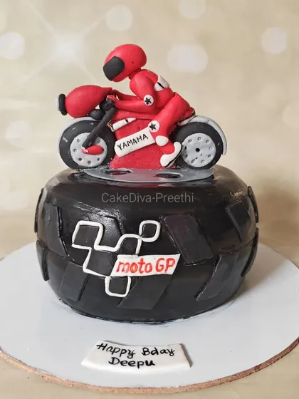 A little dirt never hurt! This MotoGP cake is for the ultimate bike lover, featuring a carved tire base and a detailed fondant rider on his Yamaha.