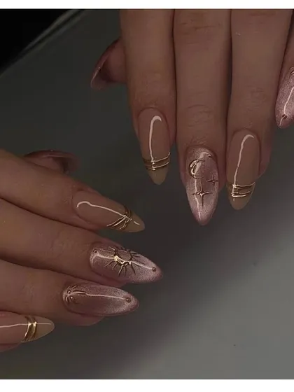 A celestial-inspired cat-eye design. This set combines a pink cat-eye base with delicate gold line art and starburst accents for a truly magical look.