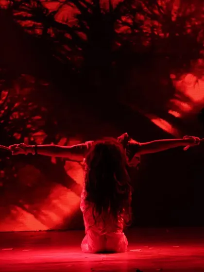 Creating a mood with dramatic lighting. This powerful silhouette shot is from a contemporary piece, where we use lighting design to enhance the emotional impact of the choreography.