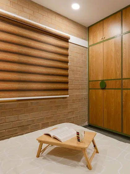 A close-up of the wardrobe, showing the fine craftsmanship and the subtle green accents.