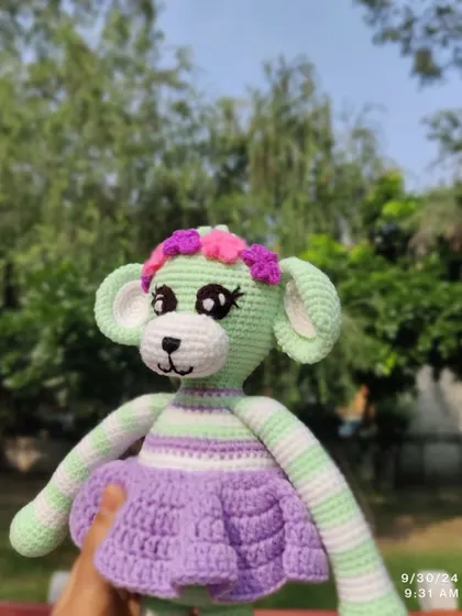 A lovely shot of the custom monkey doll against a natural background.