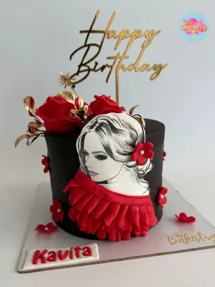 A portrait of elegance. This stunning cake features a hand-drawn portrait, accented with rich red roses and golden details for Kavita's birthday.