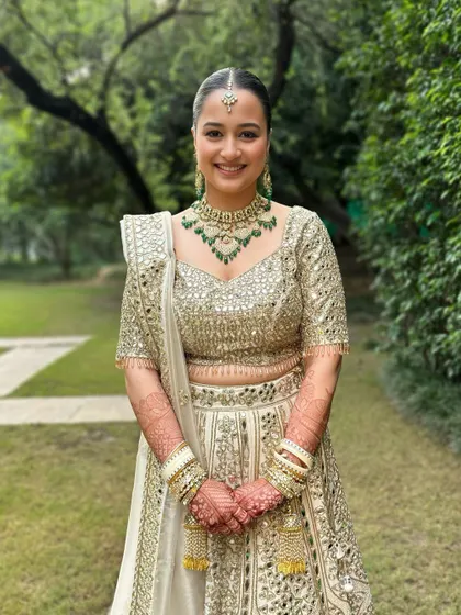 A smiling portrait that captures the joy of the moment. Her makeup is designed to look fresh and beautiful both in person and in photographs.