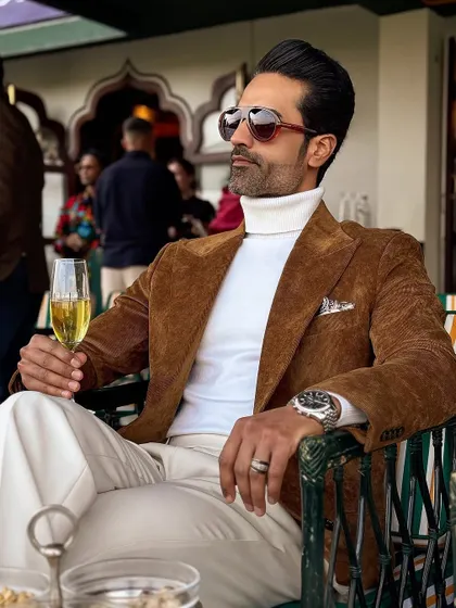 A classic look for a polo match. Our brown corduroy blazer paired with a white turtleneck and trousers for an effortlessly elegant sporting day outfit.