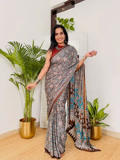 The combination of earthy tones with a pop of blue makes this printed crepe saree very unique. It's another great option for a comfortable and stylish office look from Myntra.