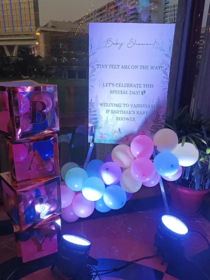I also provide personalized welcome easels that match your theme. This sign, along with the reflective 'BABY' blocks, adds a personal and modern touch to the entrance decor.