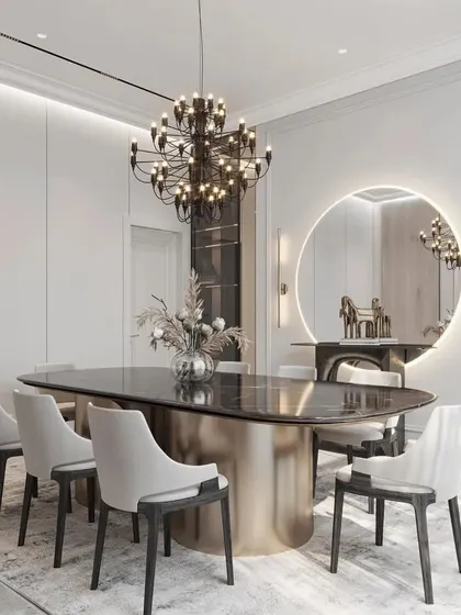 This shot focuses on the elegant details of the dining area, from the metallic base of the table to the simple yet beautiful floral arrangement.