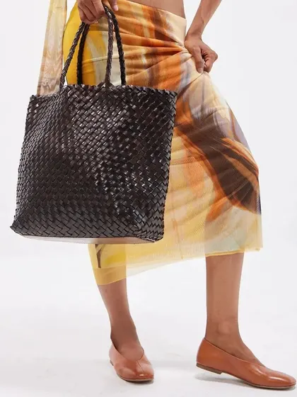 Experience the artistry of handwoven elegance. This large woven leather tote is from my Summer '24 collection, crafted with precision to offer a unique blend of style and durability.