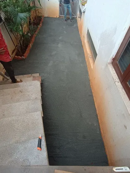 Another angle of the base preparation in a narrow side yard, showing the consistent and level surface I create.