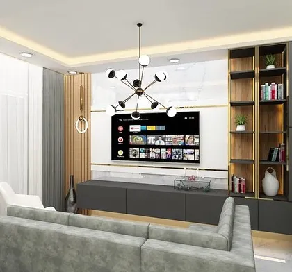 A modern living room design featuring a sleek grey TV unit with open shelving for books and decor. The combination of wood, marble, and metal finishes creates a sophisticated and contemporary feel.