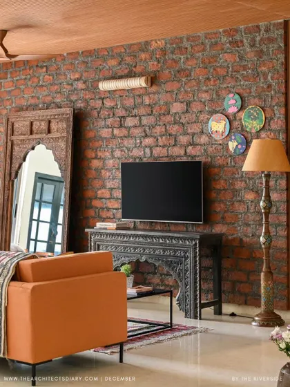 A duplicate of image 95, focusing on the rustic brick wall and carved furniture.