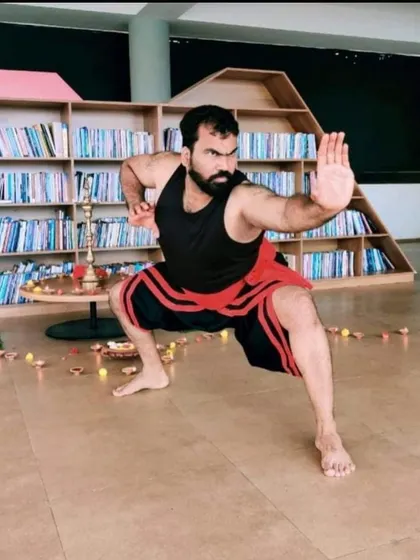 Our Kalari master Moideen Rafi holding a classic defensive posture. This stance is fundamental for developing a strong base and core, essential for both attack and defense.