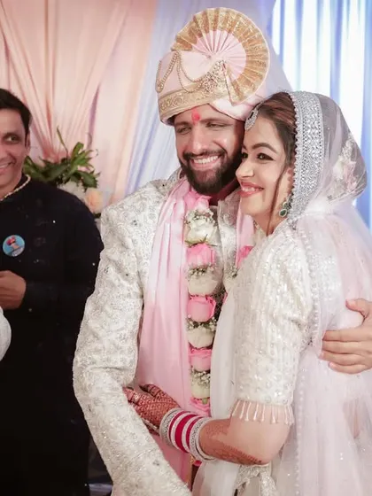 A warm hug from a family member for the happy couple. We believe in capturing the love and blessings from everyone present.
