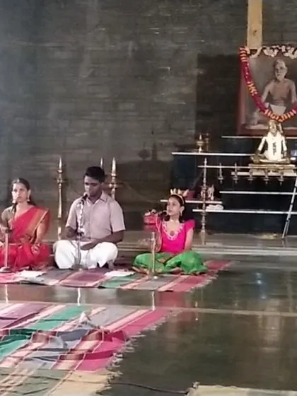 Another perspective of the musical performance during Pournami, with a portrait of Sri Ramana Maharshi watching over the young artistes.