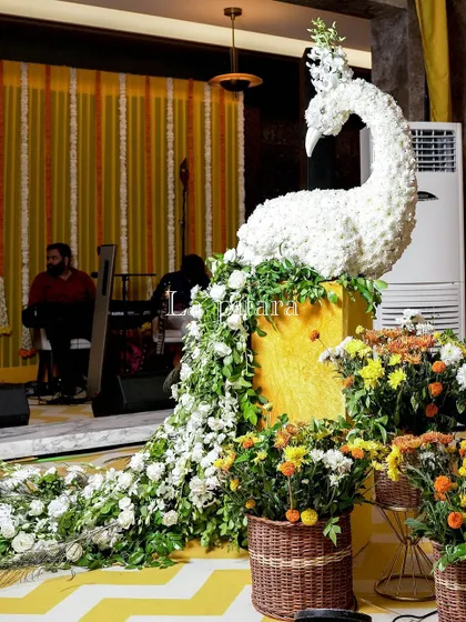 A detailed shot of one of the floral peacock sculptures from the Teej event. The intricate work showcases our commitment to creating unique, handcrafted decor elements that elevate the entire celebration.