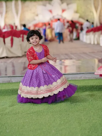 The same lavender brocade gown, paired with a cute red shrug for a different look.