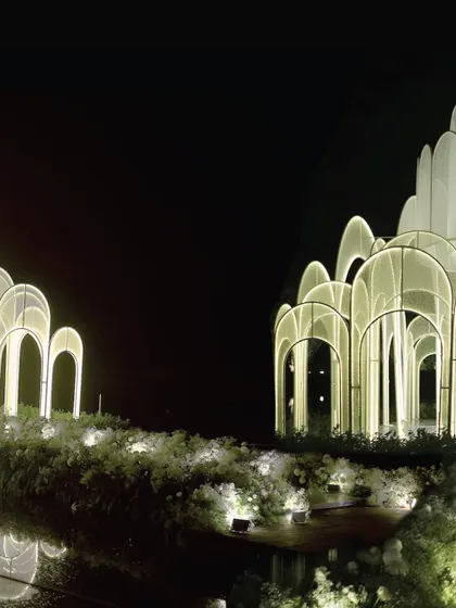The 'Floating Palace' from a distance, showing how the illuminated arches created a magical, dreamlike landmark for this unforgettable reception.