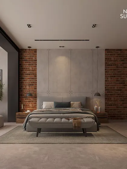 A full view of the industrial-modern bedroom, showing the balance between the exposed brick, concrete headboard, and soft furnishings. The space feels expansive, calm, and full of character.