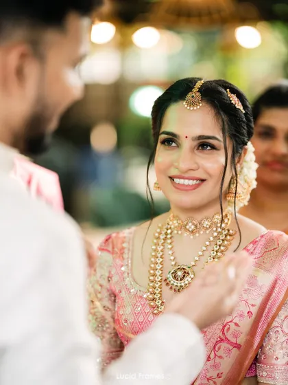 The bride's radiant smile as she looks at her groom, a perfect candid moment.
