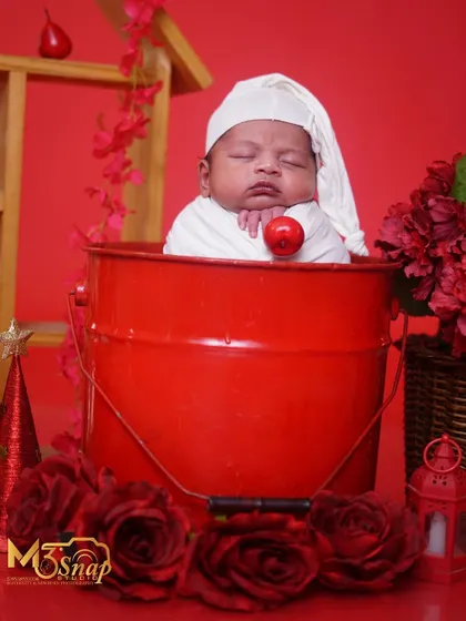 A wider view of the red bucket setup, now with Christmas-themed props. This shows how a single setup can be adapted for different looks.