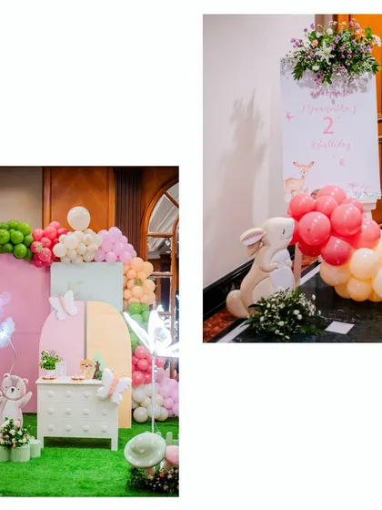 A welcoming entrance for a woodland-themed second birthday. A friendly rabbit prop and a custom sign greet guests, setting a warm and inviting tone.