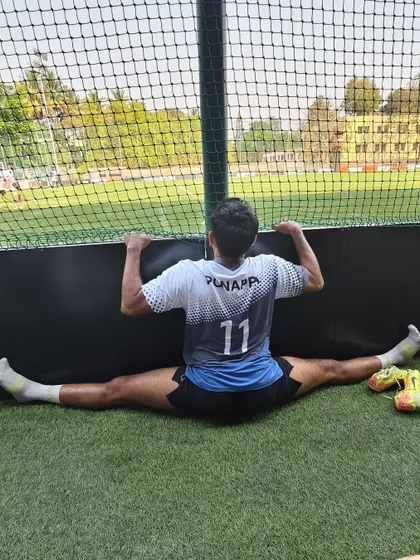 Cooling down after a tough rugby game with a middle split. Recovery is just as important as the game itself. Stretching helps my muscles relax and prepares me for the next challenge.