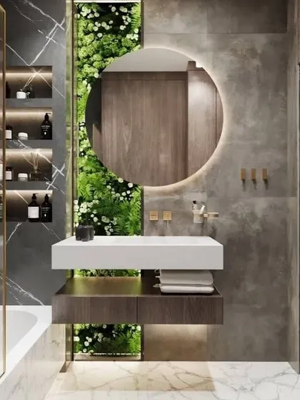 I love bringing greenery into bathrooms. This design features a stunning vertical garden behind the vanity, creating a fresh and vibrant focal point. The round backlit mirror adds a soft glow.