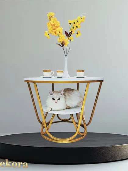 This unique coffee table features a basket-inspired design with a gold metal frame and two marble-finish surfaces. The lower tier provides a cozy nook, making it a functional and playful piece of accent furniture.