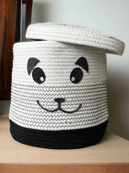 A cute panda face on a sturdy rope basket. This black and white design is timeless and works well for storing laundry or toys in a kid's bedroom.