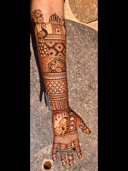 A single-arm view of a traditional bridal design, featuring a bride in a doli, peacocks, and geometric patterns.