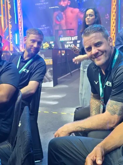 Our coaches enjoying the fights from the sidelines at an MFN event. We are passionate students of the game.