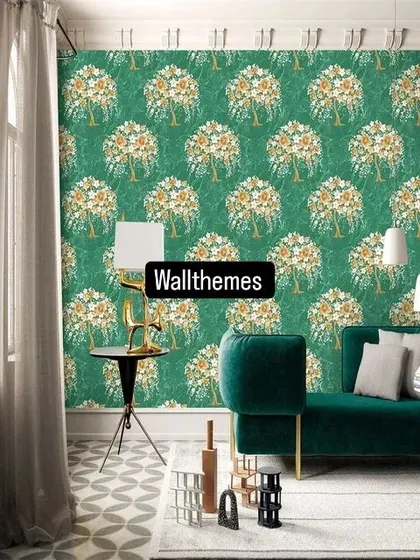 A bold living room with a dark green wallpaper featuring a repeating white floral tree pattern.