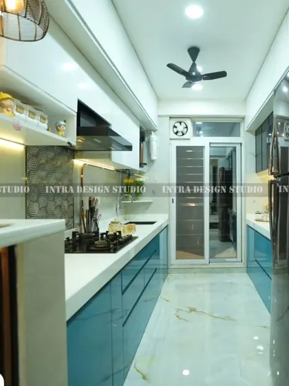 A complete perspective of the parallel kitchen, showing the workflow from the prep area and sink on one side to the cooking hob and storage on the other. The design ensures everything is within easy reach.