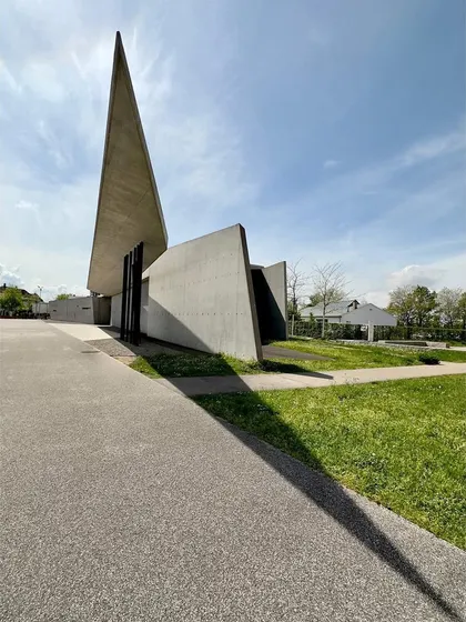 The dramatic, pointed roof of the Fire Station, a signature of Zaha Hadid's early deconstructivist style.