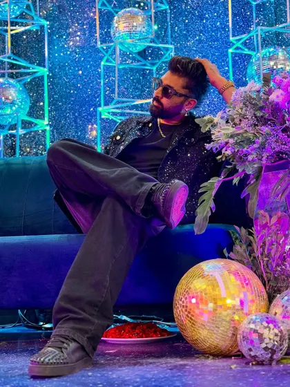 Chilling on a couch surrounded by disco balls. A rare moment of calm between gigs.