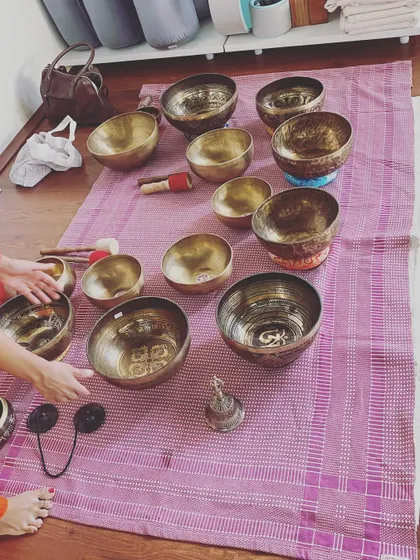 The arrangement of bowls for a sound bath is an art in itself. The different sizes and metals produce a range of frequencies that work on various energy centers in the body, promoting balance and harmony.