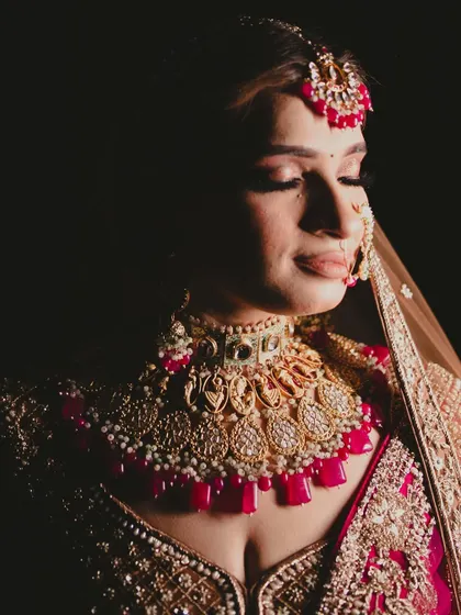 A dramatic, low-light shot of the bride, creating a timeless and artistic portrait.