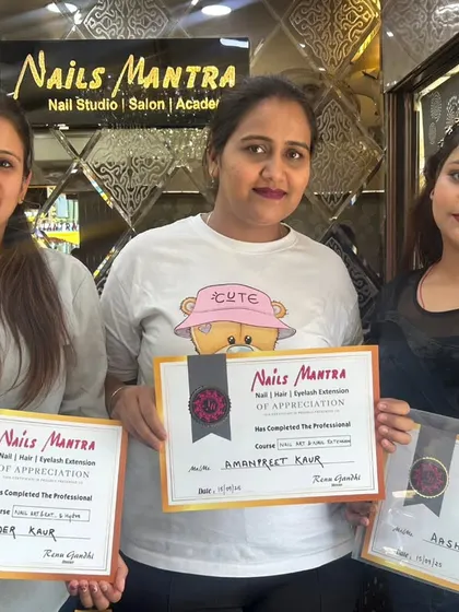 A group of happy students posing with their certificates after successfully finishing their professional training. It’s always a proud moment for us to see our students graduate.