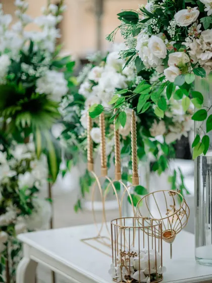 A close-up of the decor details from an intimate Mehendi. I used a mix of real and whimsical tissue florals with gold accents to create a delicate and romantic setting.